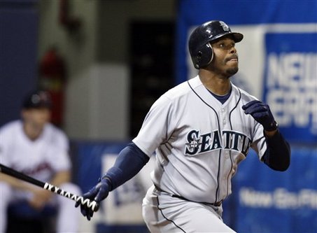 Seattle Mariners' Ken Griffey Jr. connects for a solo home run off Minnesota Twins pitcher Francisco Liriano during the fifth inning of an MLB baseball game in Minneapolis, Monday, April 6, 2009.  (AP Photo/Ann Heisenfelt)